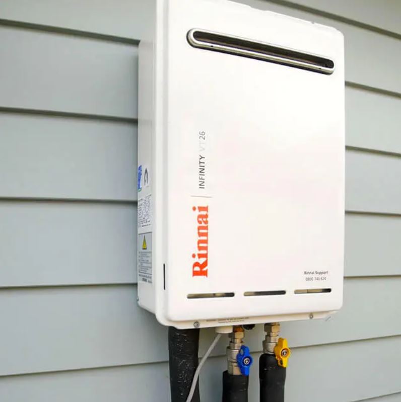 Rinnai gas hot water system installed on side of residential home.