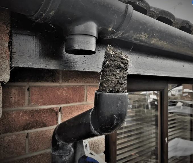 Gutter and downpipes badly damaged in a residential home