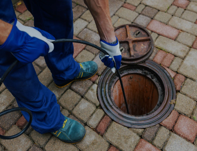Sewer repairs with J&G Plumbing Solutions plumber fixing the sewer
