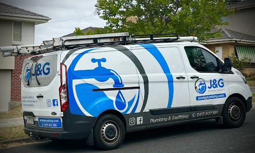 J&G Plumbing Solutions van parked outside a customer's house.